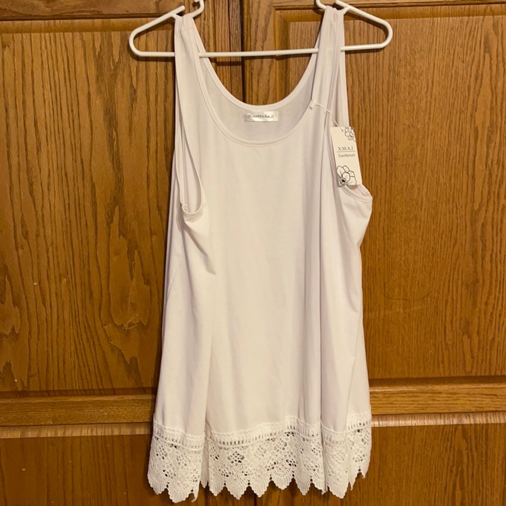 Beautiful white sleeveless shirt under jackets or alone
